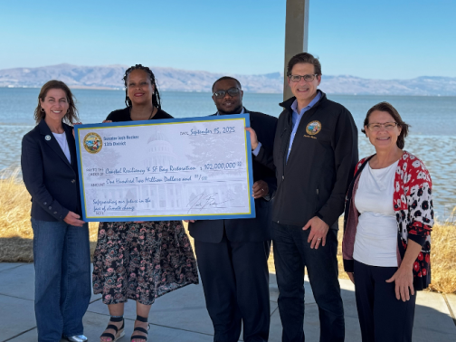Senator Becker presenting a symbolic check with Assemblymember Diane Papan, San Mateo County Supervisor Lisa Gauthier, Pacifica Mayor Sue Beckmeyer, and  East Palo Alto Councilmember Webster Lincoln.