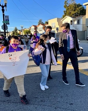 Students, Senator Josh Becker and other education advocates walk to Martin Elementary School to honor civil rights icon Ruby Bridges.