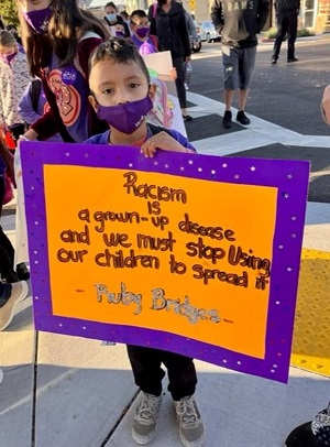 Martin Elementary School student showing his support for Ruby Bridges Walk to School Day.