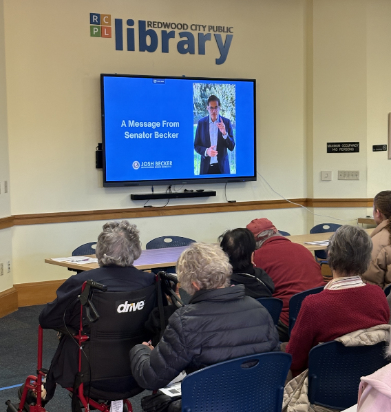 Constituents watching a message from Senator Becker.